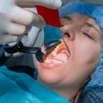 Patient experiencing severe toothache needing emergency dentist in Kansas City MO